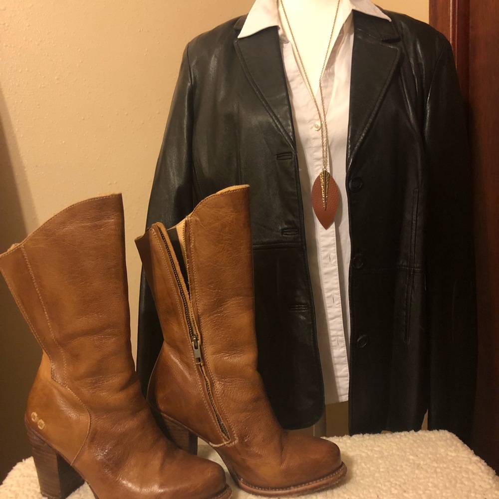 Studio Y, leather jacket with blue satin lining.